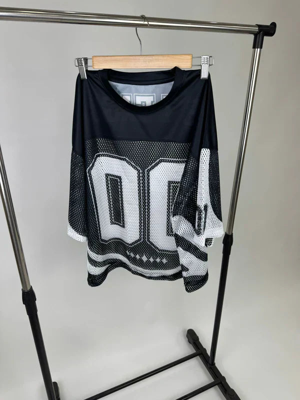 Black drop shoulder t-shirt hanging on rack