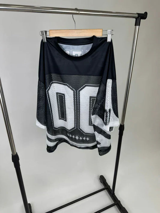 Black drop shoulder t-shirt hanging on rack