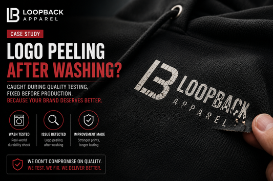 Close-up of a hoodie logo peeling after washing during quality testing before production improvements.