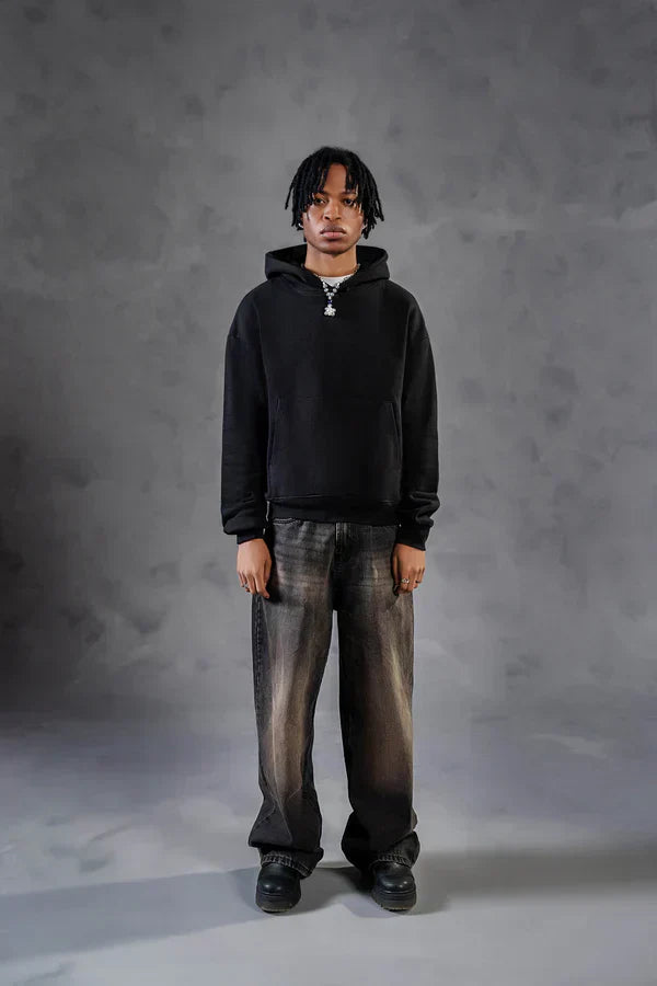 Black hoodie paired with baggy jeans