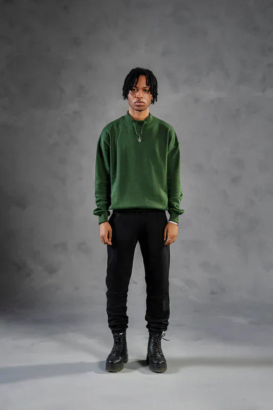 Straight leg sweatpants paired with green sweatshirt