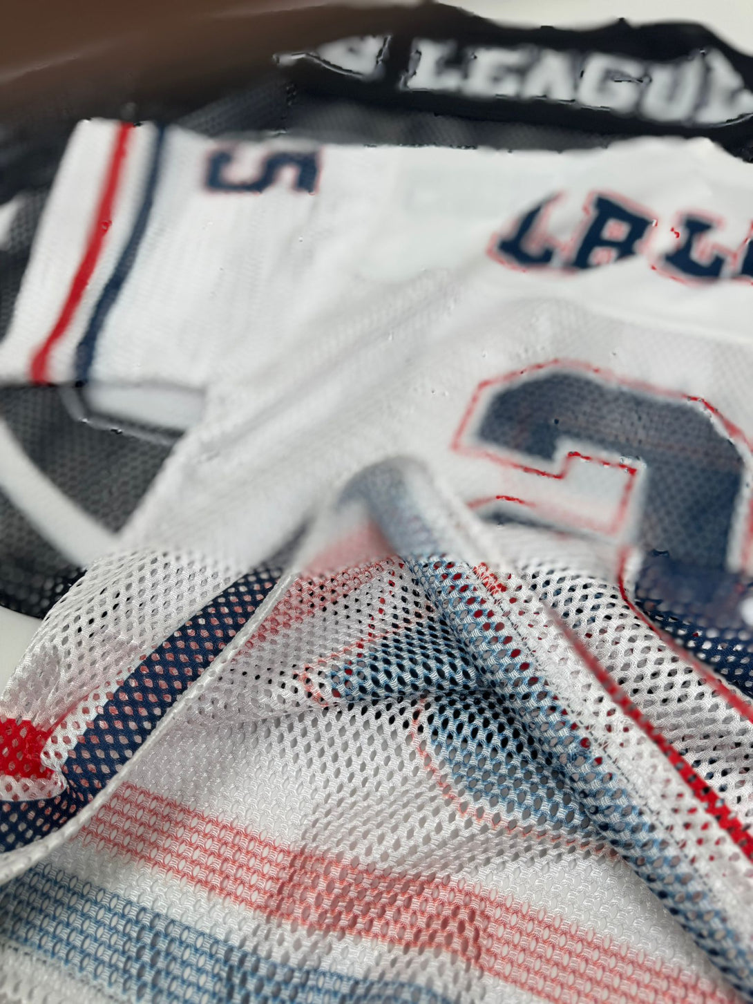 Close-up of a sports jersey with visible branding and design details.